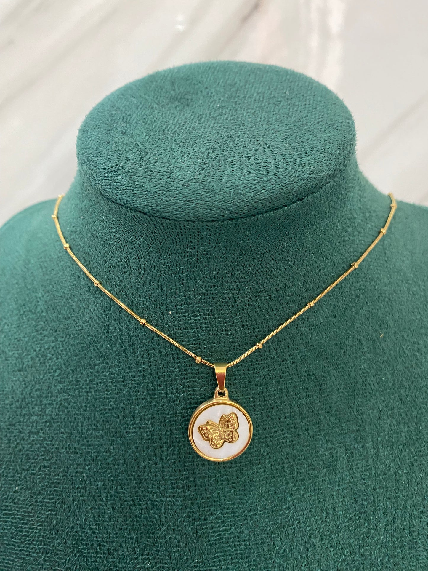 Gold Round Butterfly Necklace featuring a delicate butterfly design inside a round pendant. Crafted from premium stainless steel, this waterproof and tarnish-free necklace is perfect for everyday wear, weddings, parties, gifting, and special occasions.