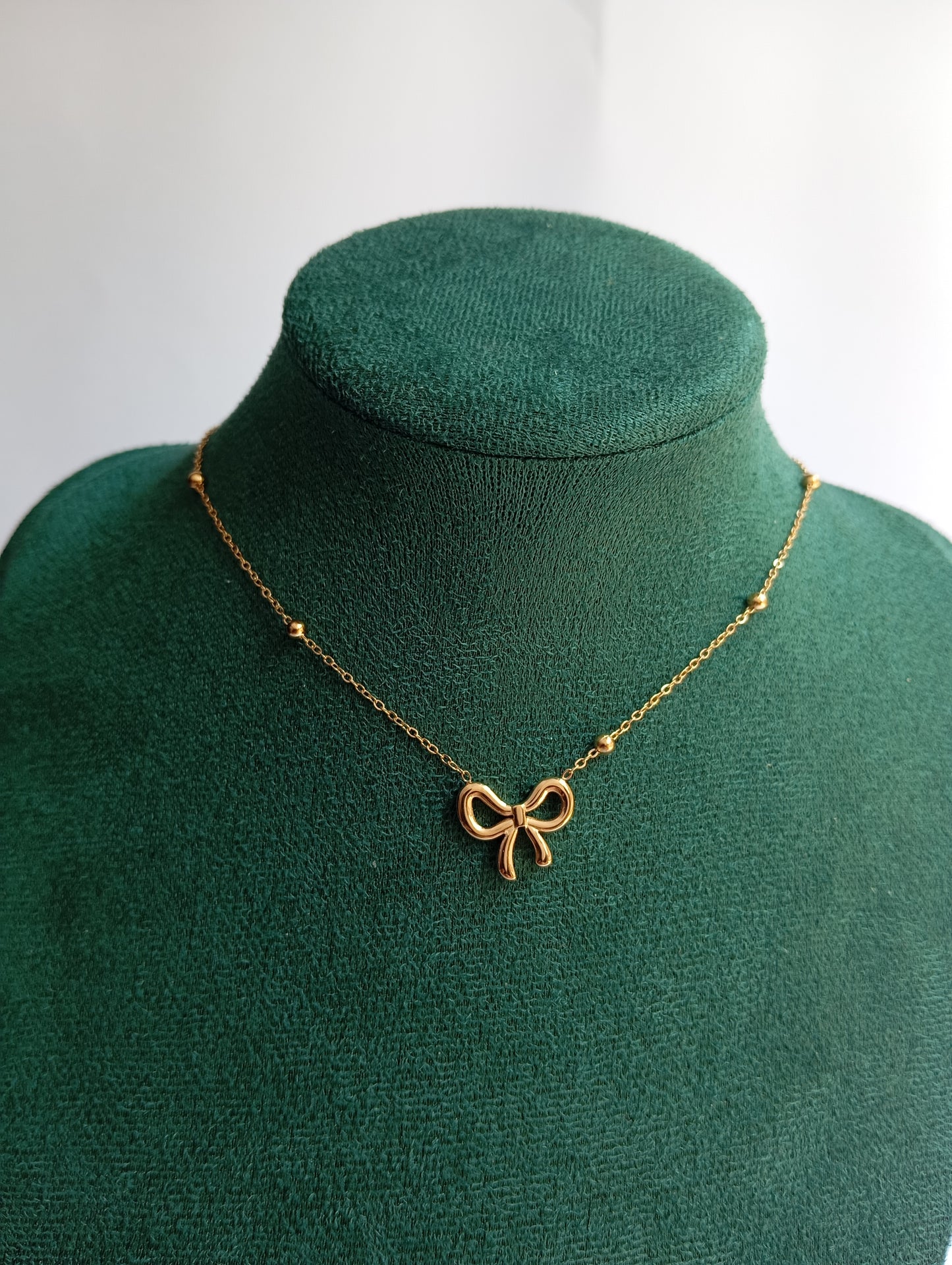 Stainless Steel Bow Necklace featuring a delicate bow-shaped pendant crafted from premium stainless steel. Waterproof, tarnish-free jewelry for women, perfect for daily wear, parties, weddings, gifting, office wear, and elegant fashion styling.