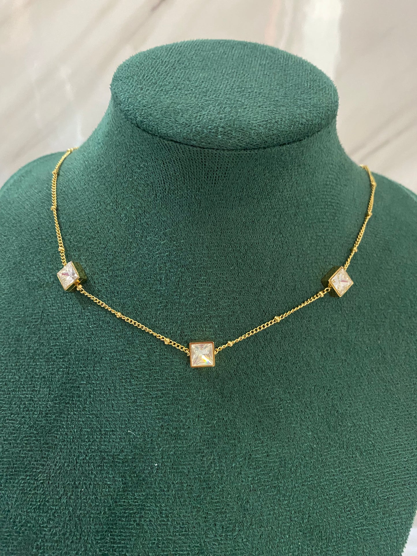 Gold Trio Gemstone Necklace featuring three sparkling gemstone-inspired stones in an elegant pendant design. Crafted from premium stainless steel, this waterproof and tarnish-free necklace is perfect for women’s daily wear, weddings, parties, gifting, and special occasions.