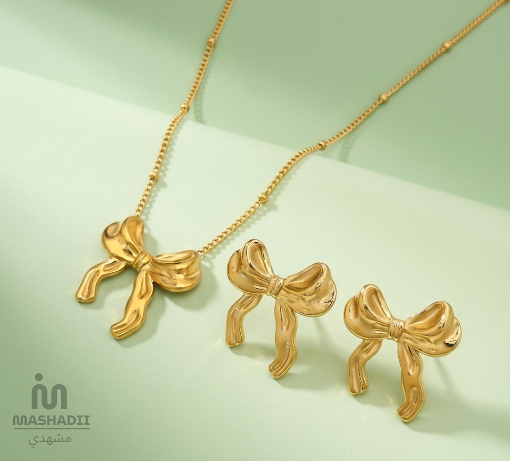 Golden Bow Jewelry Set featuring a matching necklace and earrings with an elegant bow design. Stainless steel jewelry set for women, waterproof, tarnish-free, colour guaranteed, perfect for daily wear, weddings, parties, gifting, and special occasions.