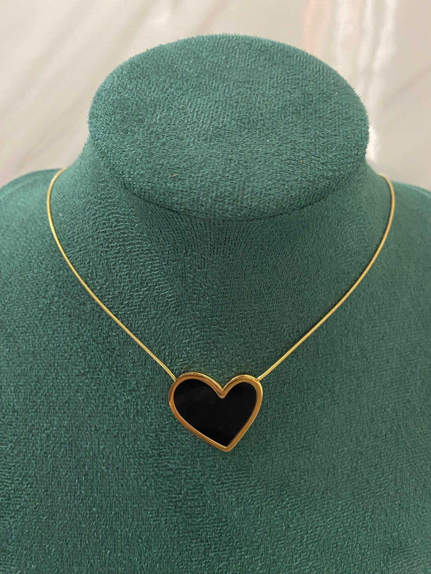 Gold Black Stone Heart Necklace featuring a heart-shaped pendant with an elegant black stone centerpiece. Crafted from premium stainless steel, this waterproof and tarnish-free necklace is ideal for daily wear, romantic gifting, anniversaries, parties, weddings, and special occasions.

