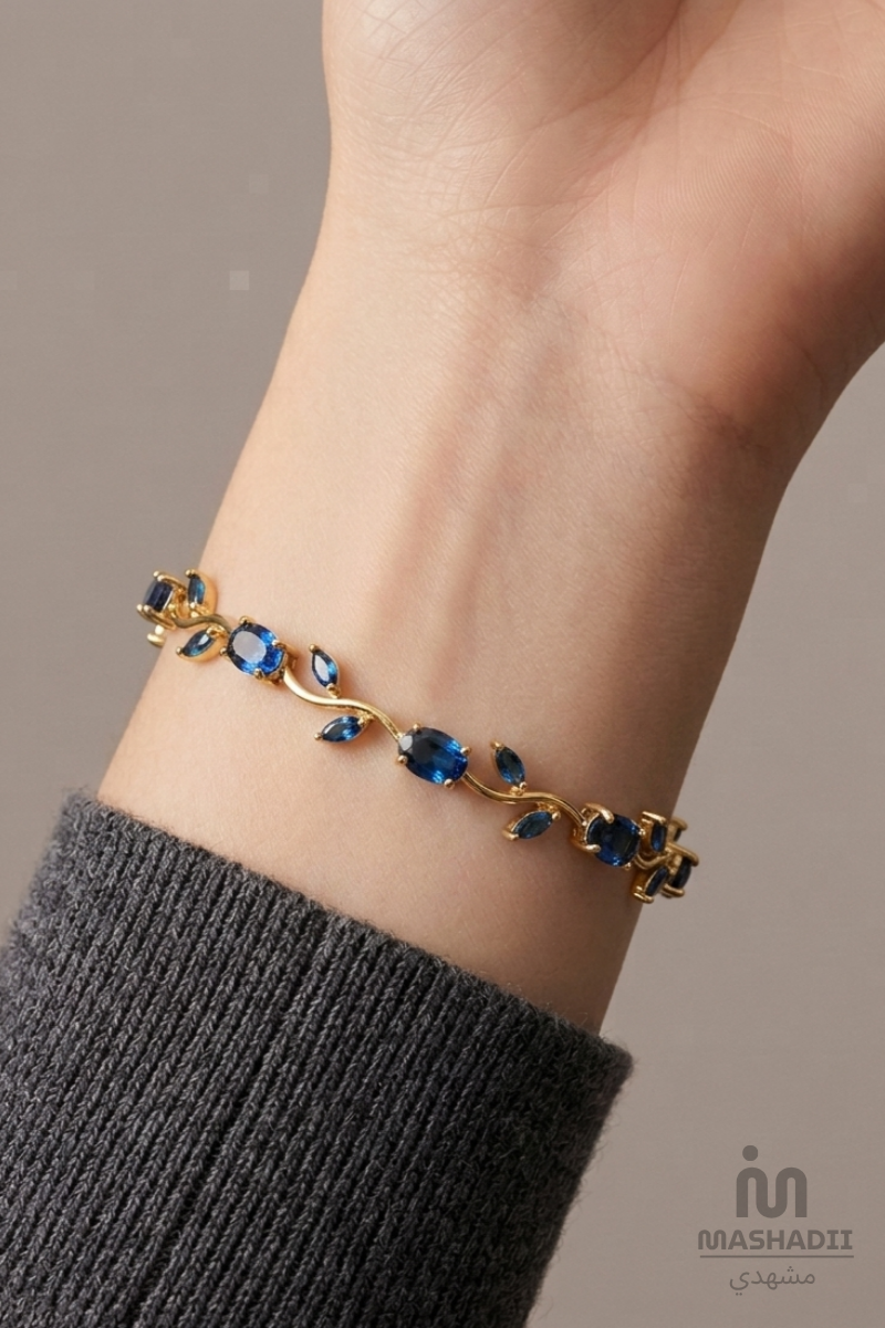 Blue Crystal Tulip Bracelet crafted from premium stainless steel with sparkling blue crystal accents and an elegant tulip flower design. Waterproof, tarnish free bracelet for women with long-lasting shine and durability.
