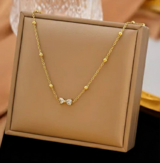 Gold Bow Crystal Necklace featuring a sparkling crystal-studded bow pendant crafted from premium stainless steel. Waterproof and tarnish-free necklace for women, ideal for daily wear, parties, weddings, gifting, and elegant fashion styling.
