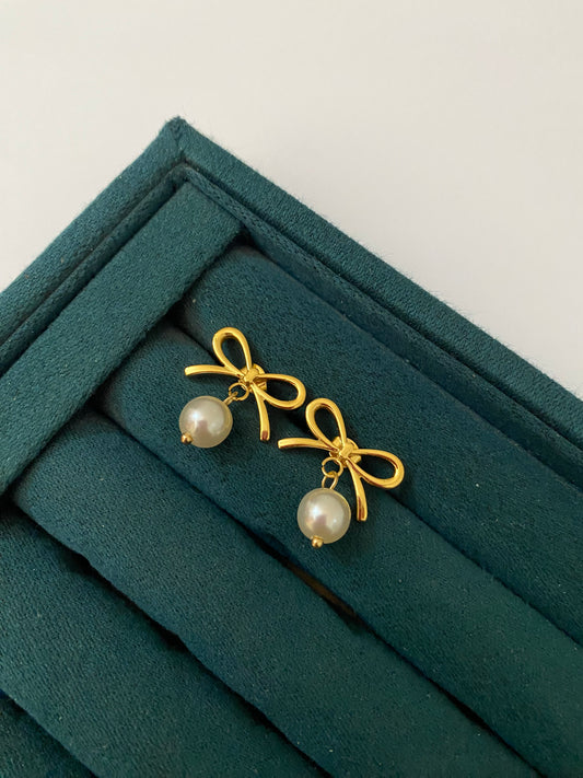 Elegant Bow Pearl Earrings featuring lustrous pearl accents and a stylish bow design, crafted from premium stainless steel. Waterproof, tarnish free, lightweight earrings for women with long-lasting shine.