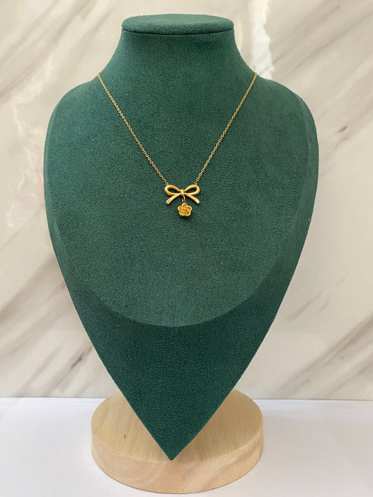 Gold Cute Flower with Bow Necklace featuring a charming flower pendant accented with an elegant bow, crafted from premium stainless steel. Waterproof, tarnish-free jewelry for women, perfect for daily wear, parties, weddings, gifting, and stylish everyday fashion.
