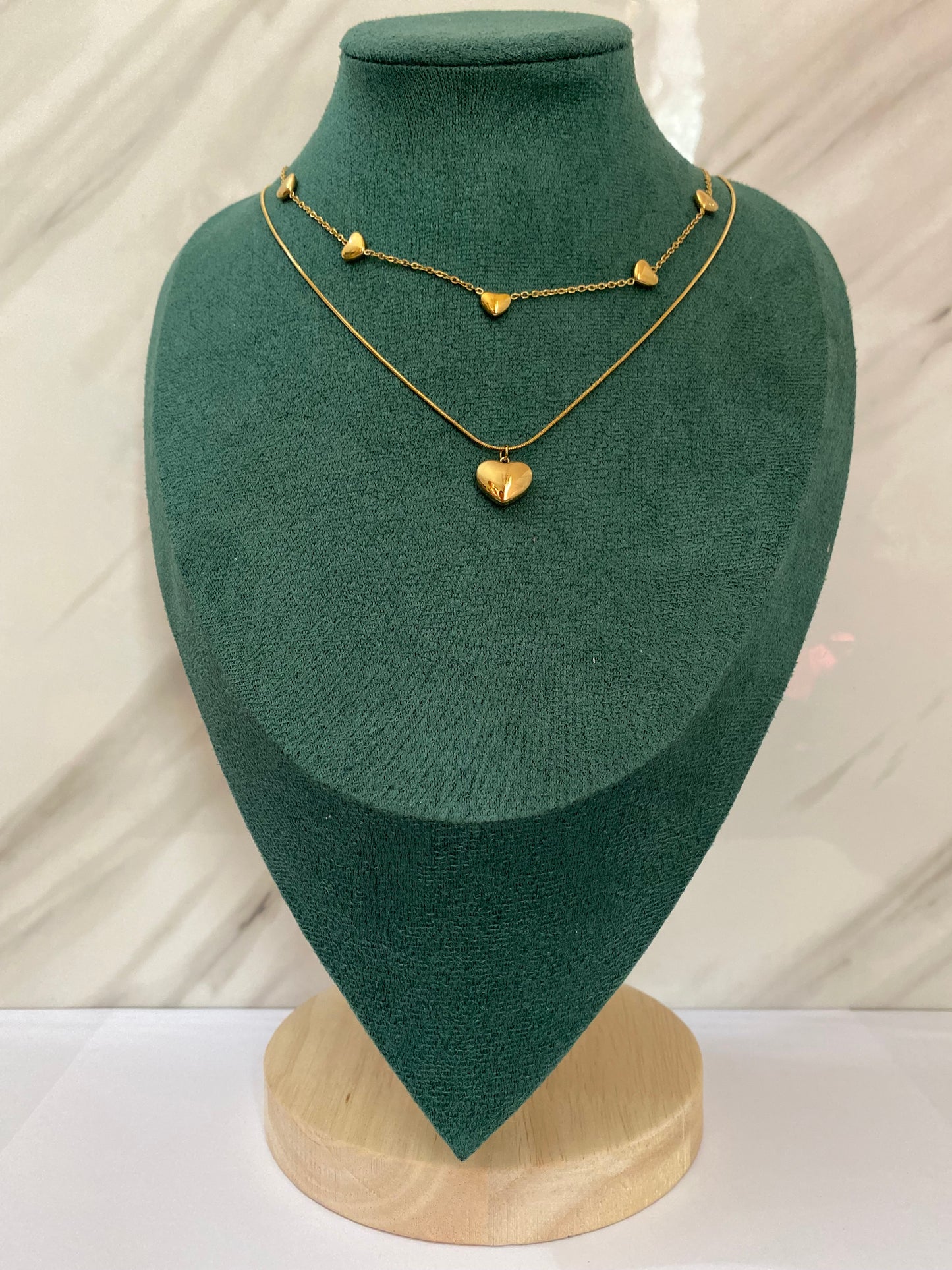 Gold Double Layer Multi Heart Necklace featuring layered chains with multiple heart-shaped charms crafted from premium stainless steel. Waterproof, tarnish-free jewelry for women, ideal for daily wear, anniversaries, parties, weddings, gifting, and elegant fashion styling.
