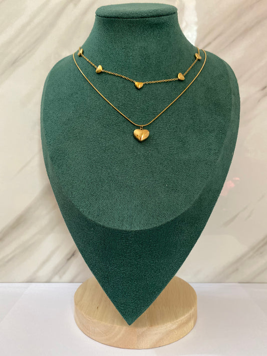 Gold Double Layer Multi Heart Necklace featuring layered chains with multiple heart-shaped charms crafted from premium stainless steel. Waterproof, tarnish-free jewelry for women, ideal for daily wear, anniversaries, parties, weddings, gifting, and elegant fashion styling.
