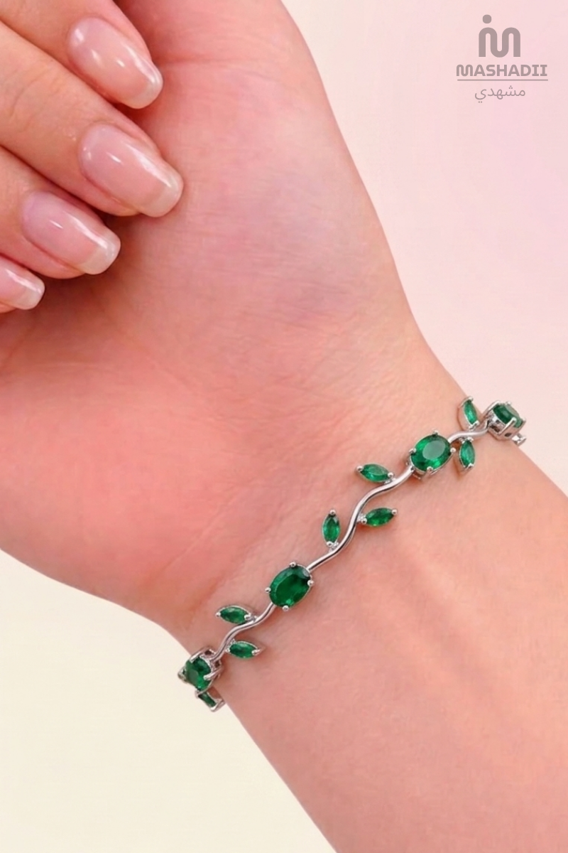 Green Crystal Silver Tulip Bracelet crafted from premium stainless steel with sparkling green crystal accents and an elegant tulip-inspired design. Waterproof, tarnish free bracelet for women with long-lasting shine and durability.