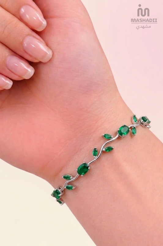 Green Crystal Silver Tulip Bracelet crafted from premium stainless steel with sparkling green crystal accents and an elegant tulip-inspired design. Waterproof, tarnish free bracelet for women with long-lasting shine and durability.