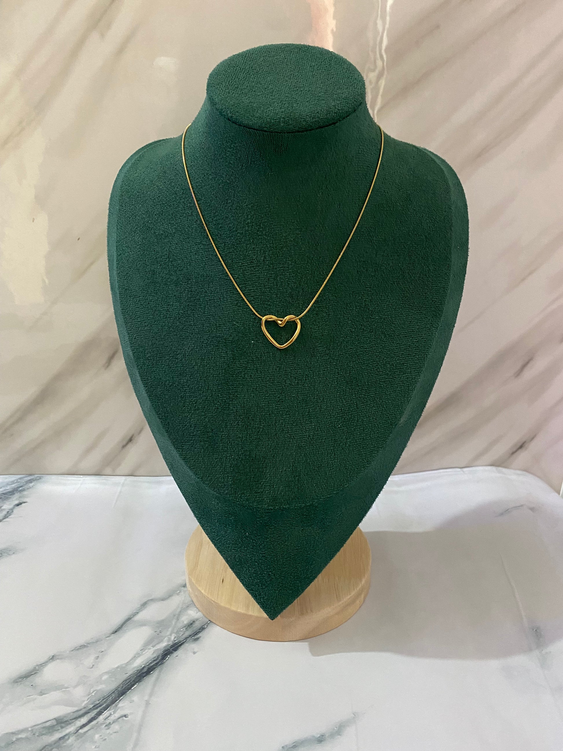 Gold Halo Loop Heart Necklace featuring an elegant heart motif surrounded by a stylish halo loop design. Crafted from premium stainless steel, this waterproof and tarnish-free necklace is perfect for women’s everyday wear, anniversaries, parties, weddings, gifting, and special occasions.
