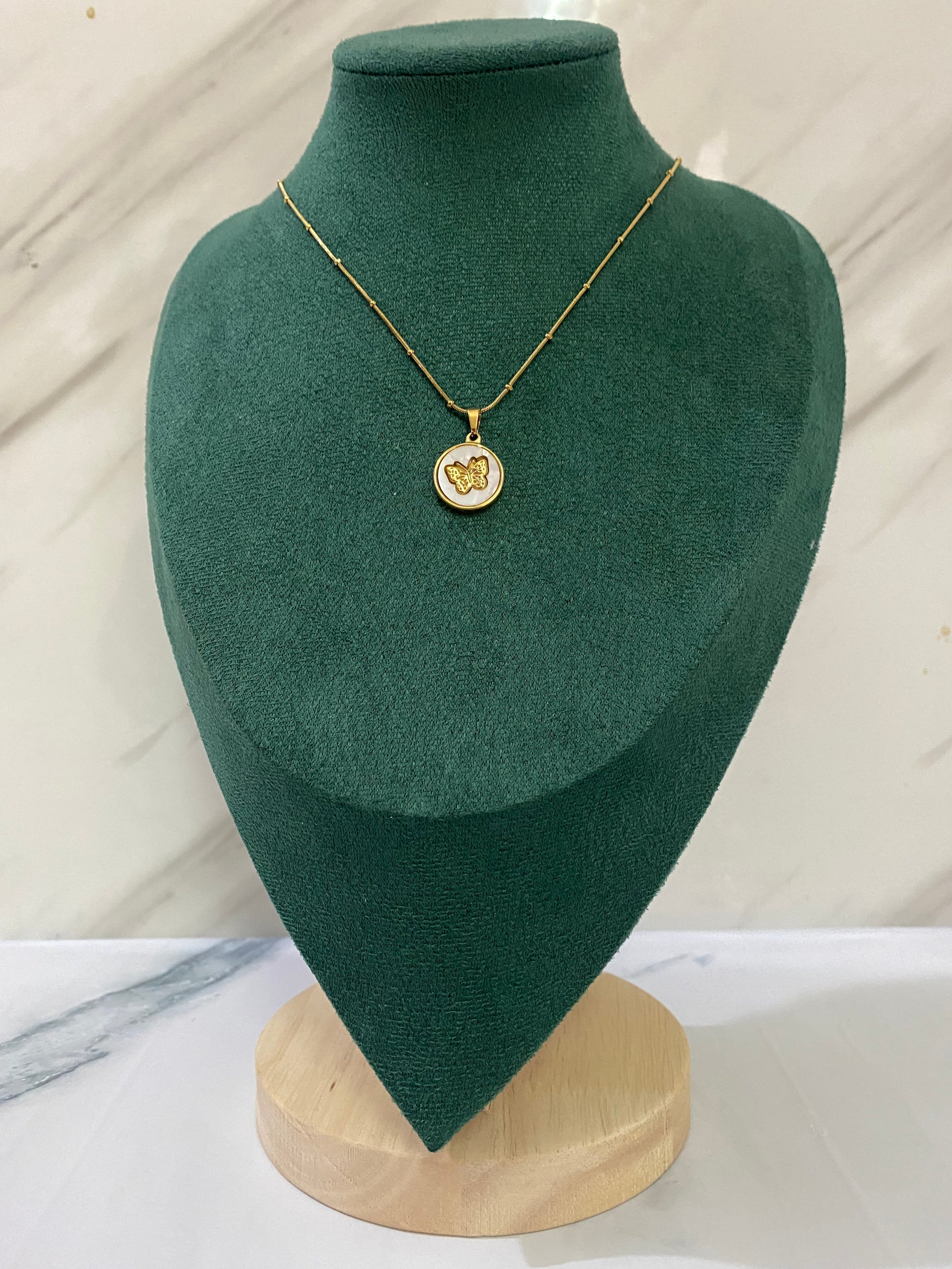 Gold Round Butterfly Necklace featuring a delicate butterfly design inside a round pendant. Crafted from premium stainless steel, this waterproof and tarnish-free necklace is perfect for everyday wear, weddings, parties, gifting, and special occasions.
