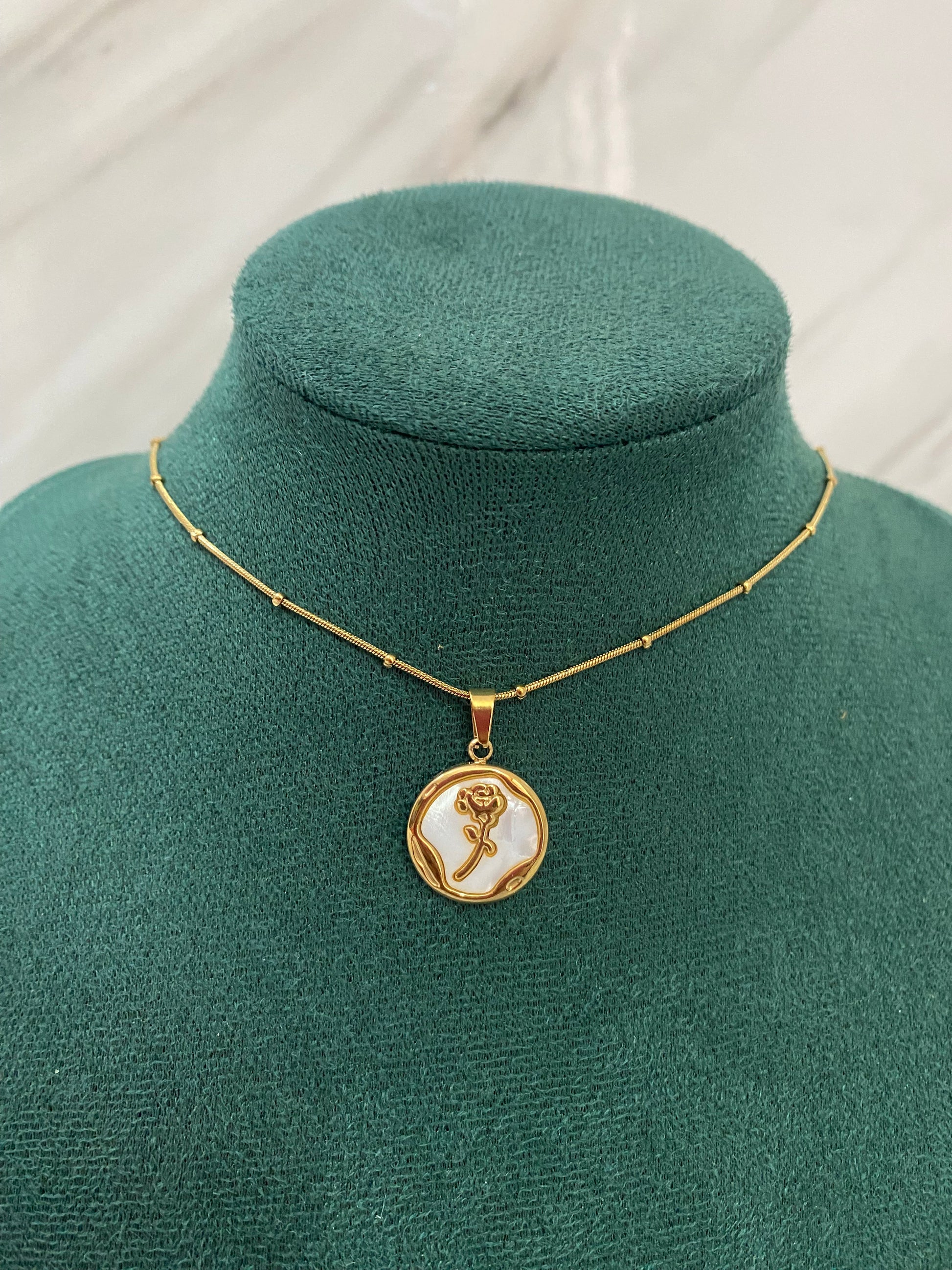 Gold Round Rose Necklace featuring a delicate rose motif inside a round pendant. Crafted from premium stainless steel, this waterproof and tarnish-free necklace is perfect for women’s everyday wear, parties, weddings, gifting, and elegant styling.
