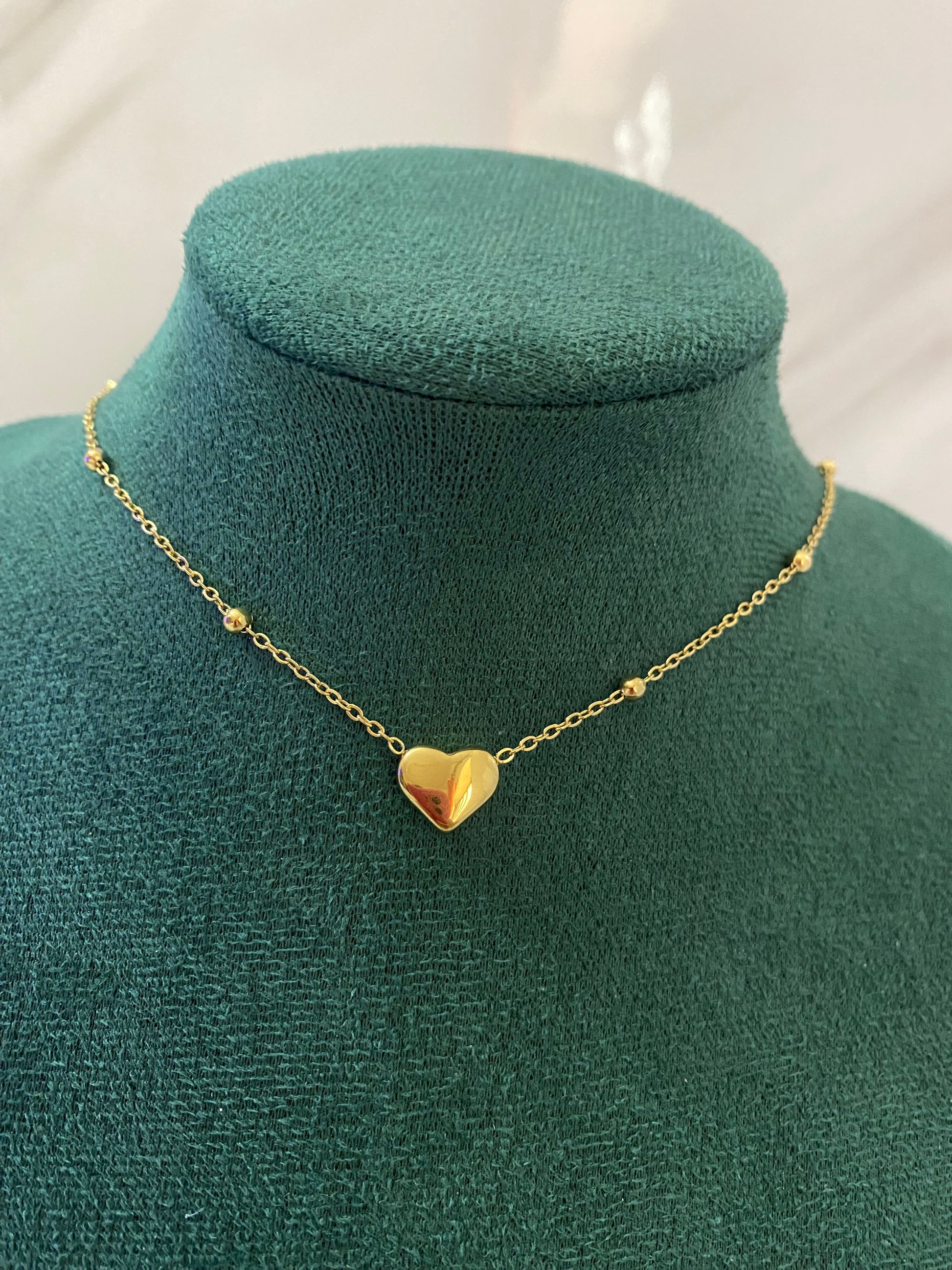 Gold Solid Heart Necklace featuring a polished heart-shaped pendant crafted from premium stainless steel. Waterproof, tarnish-free necklace for women, perfect for daily wear, romantic gifting, anniversaries, parties, weddings, and elegant fashion styling.

