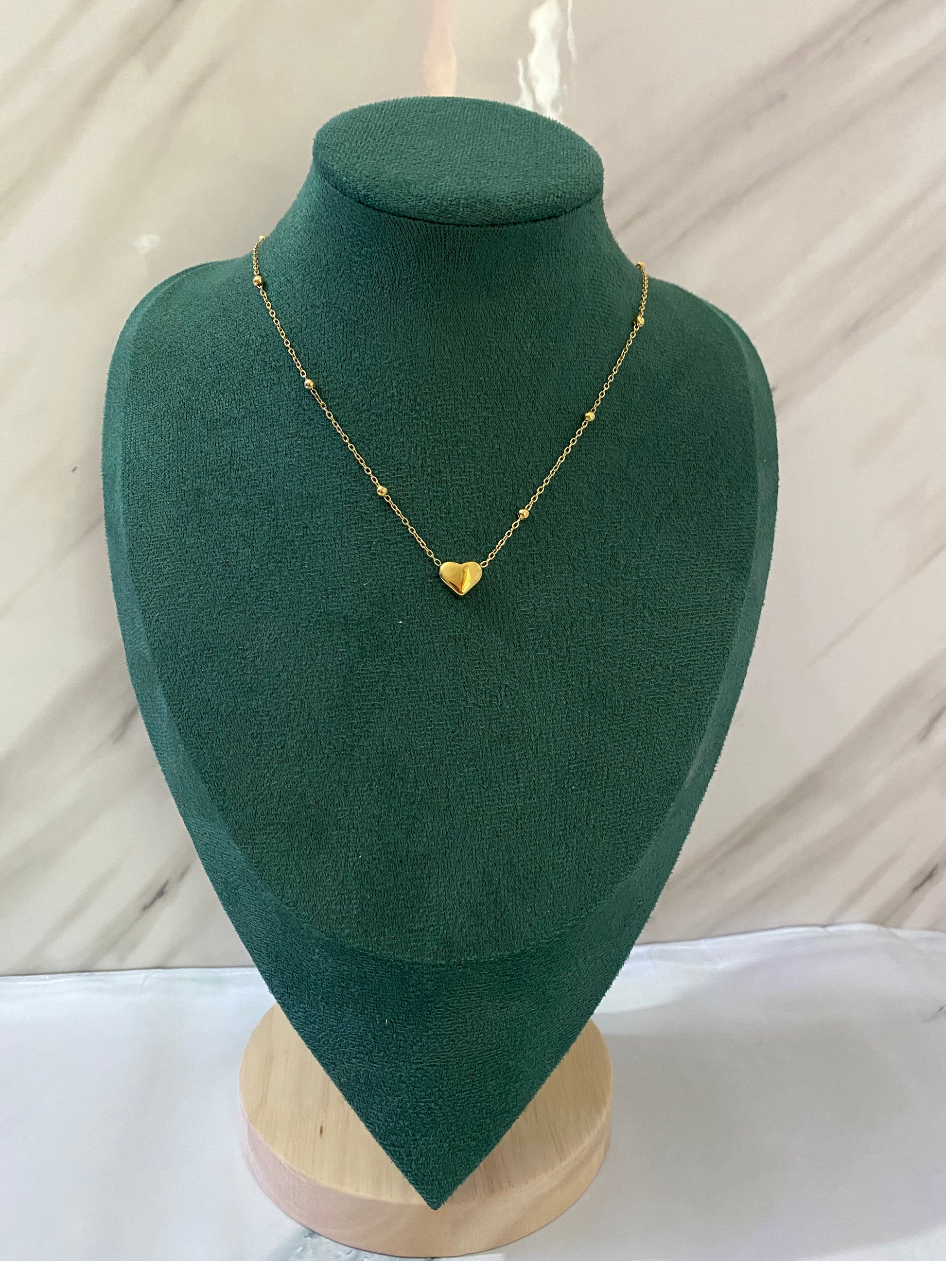 Gold Solid Heart Necklace featuring a polished heart-shaped pendant crafted from premium stainless steel. Waterproof, tarnish-free necklace for women, perfect for daily wear, romantic gifting, anniversaries, parties, weddings, and elegant fashion styling.
