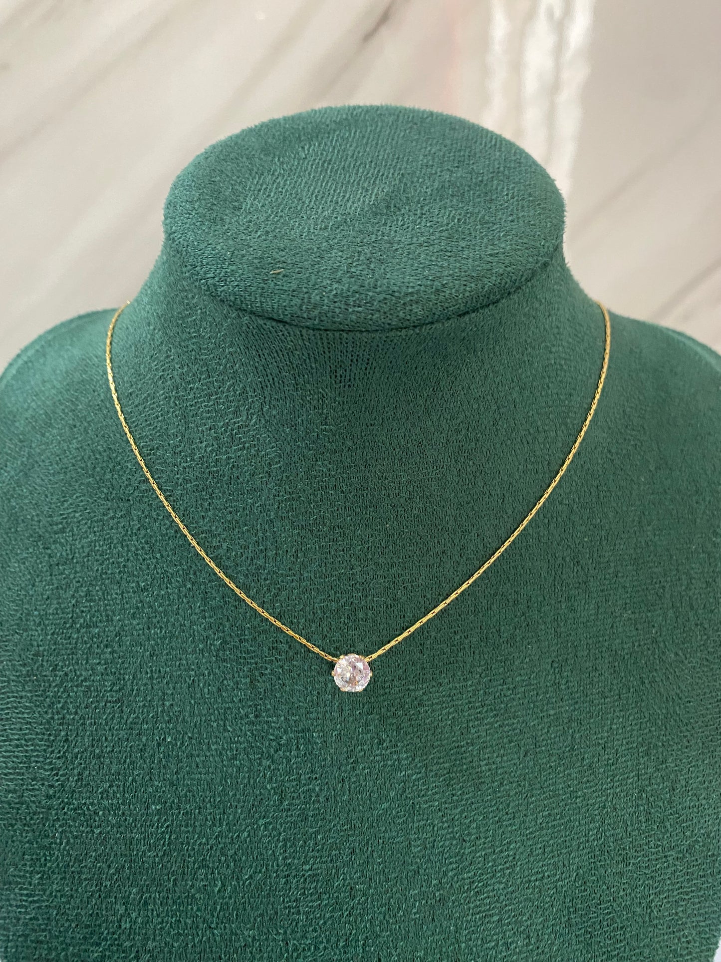 Gold Solitaire Necklace featuring a sparkling solitaire stone pendant crafted from premium stainless steel. Waterproof, tarnish-free jewelry for women, perfect for everyday wear, weddings, parties, gifting, anniversaries, and elegant fashion styling.

