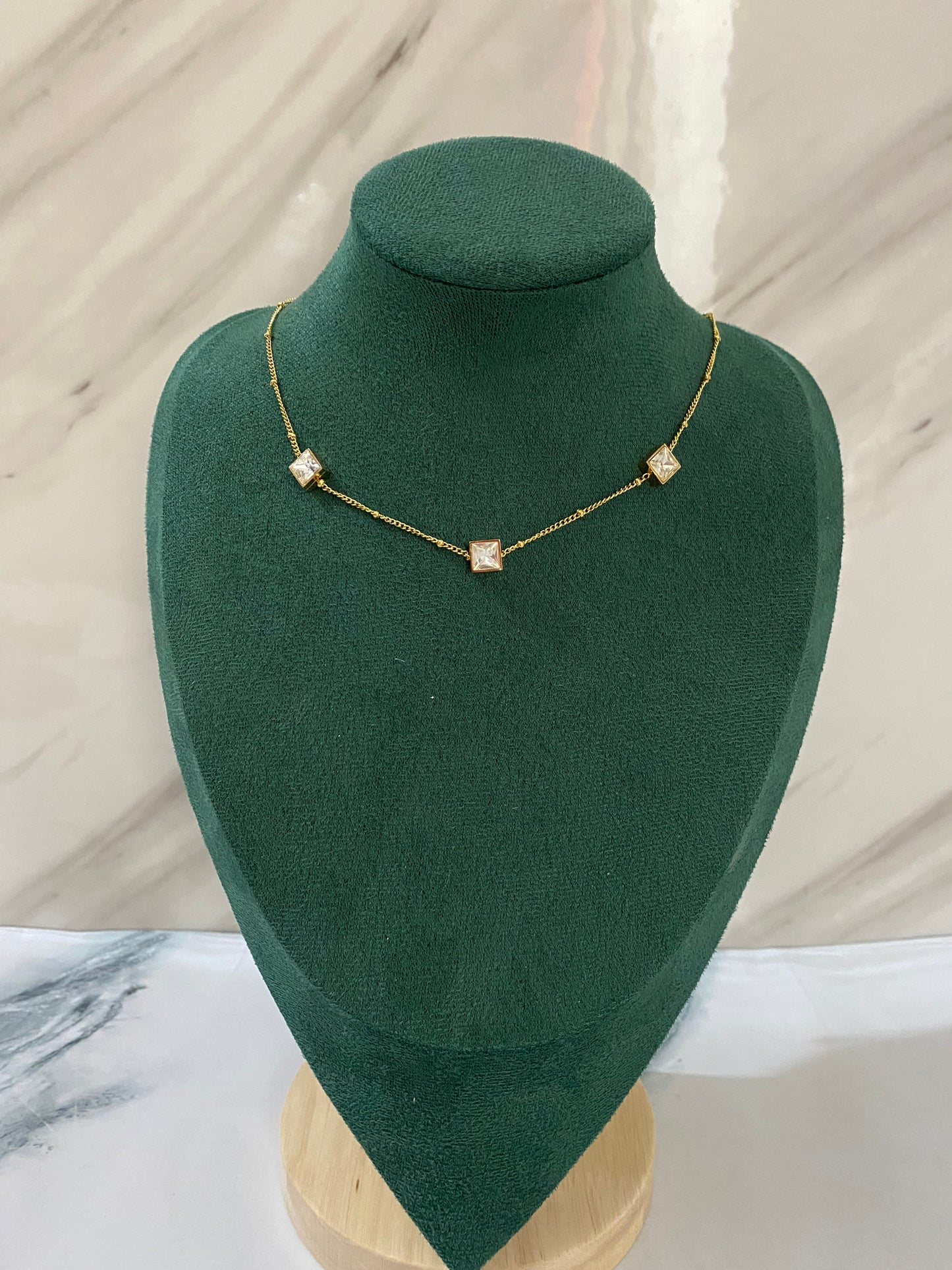 Gold Trio Gemstone Necklace featuring three sparkling gemstone-inspired stones in an elegant pendant design. Crafted from premium stainless steel, this waterproof and tarnish-free necklace is perfect for women’s daily wear, weddings, parties, gifting, and special occasions.

