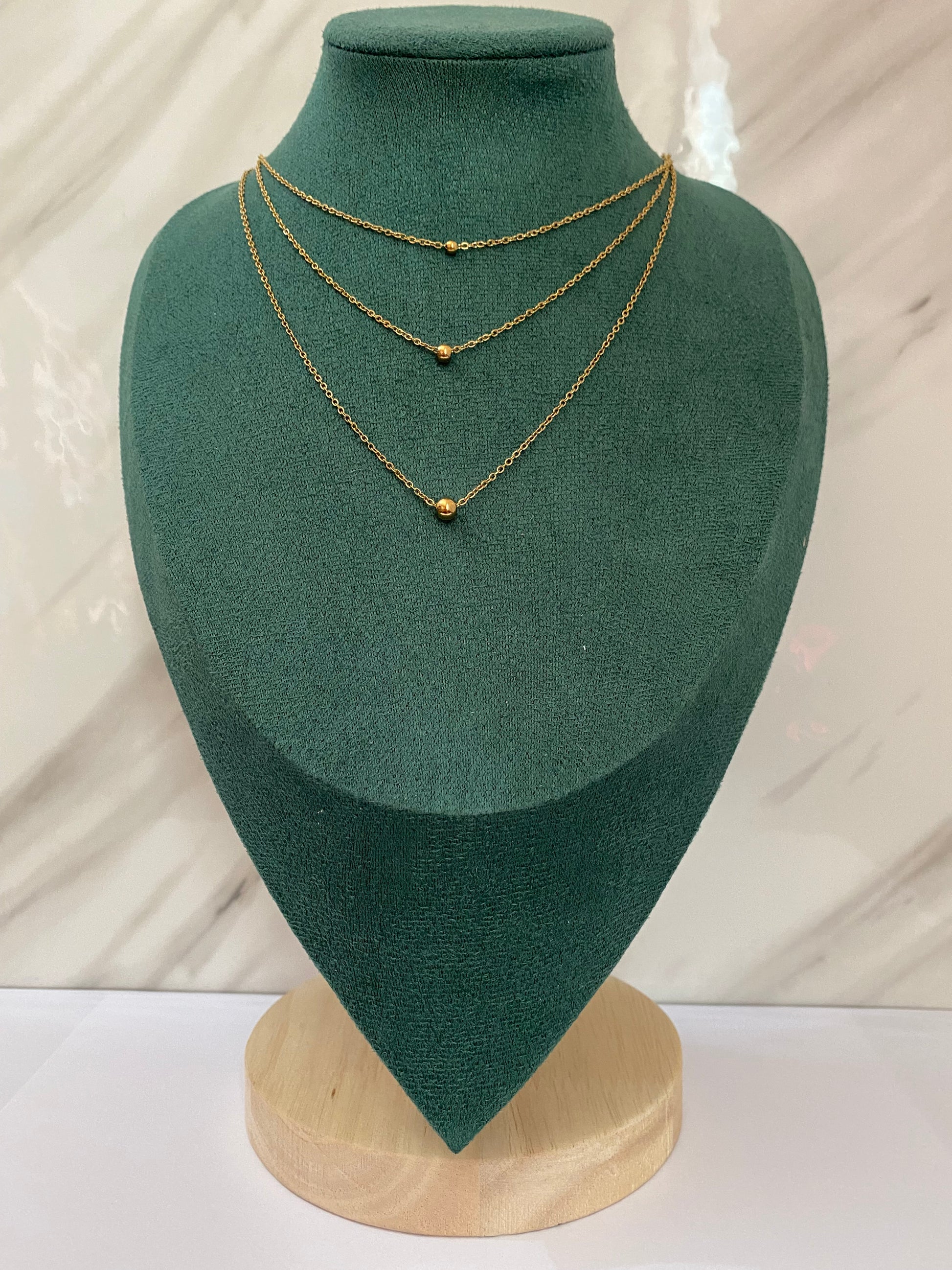 Gold Triple Layered Dotted Necklace featuring three layered chains with delicate dotted accents. Crafted from premium stainless steel, this waterproof and tarnish-free necklace is perfect for women’s everyday wear, layering, parties, weddings, gifting, and modern fashion styling.
