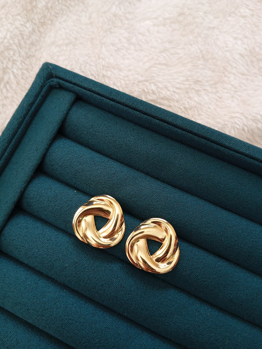Golden Twisted Earrings crafted from premium stainless steel with an elegant twisted design and long-lasting gold finish. Waterproof, tarnish-free earrings for women, perfect for daily wear, office wear, parties, weddings, gifting, and special occasions.
