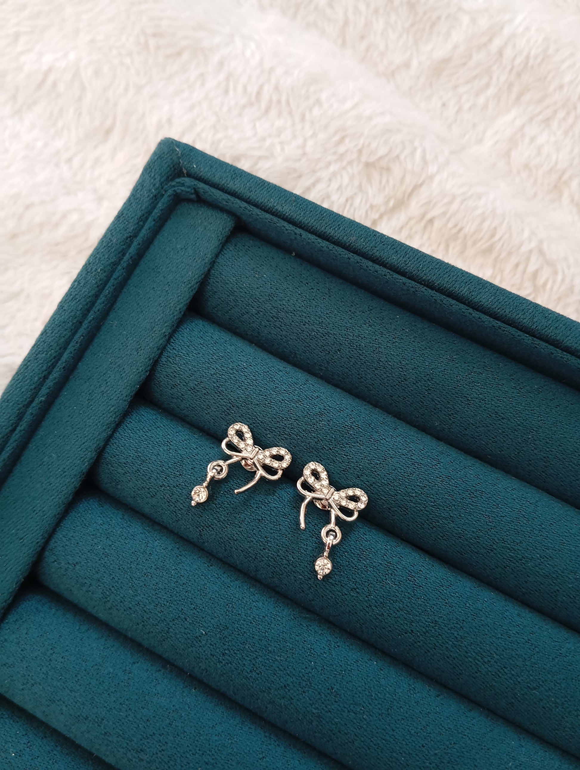 Silver Bow Stud Earrings crafted from premium stainless steel with an elegant bow design and polished silver finish. Waterproof, tarnish-free stud earrings for women, perfect for daily wear, office wear, parties, weddings, gifting, and special occasions.