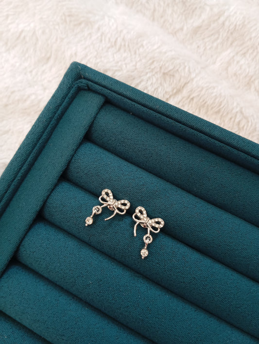 Silver Bow Stud Earrings crafted from premium stainless steel with an elegant bow design and polished silver finish. Waterproof, tarnish-free stud earrings for women, perfect for daily wear, office wear, parties, weddings, gifting, and special occasions.