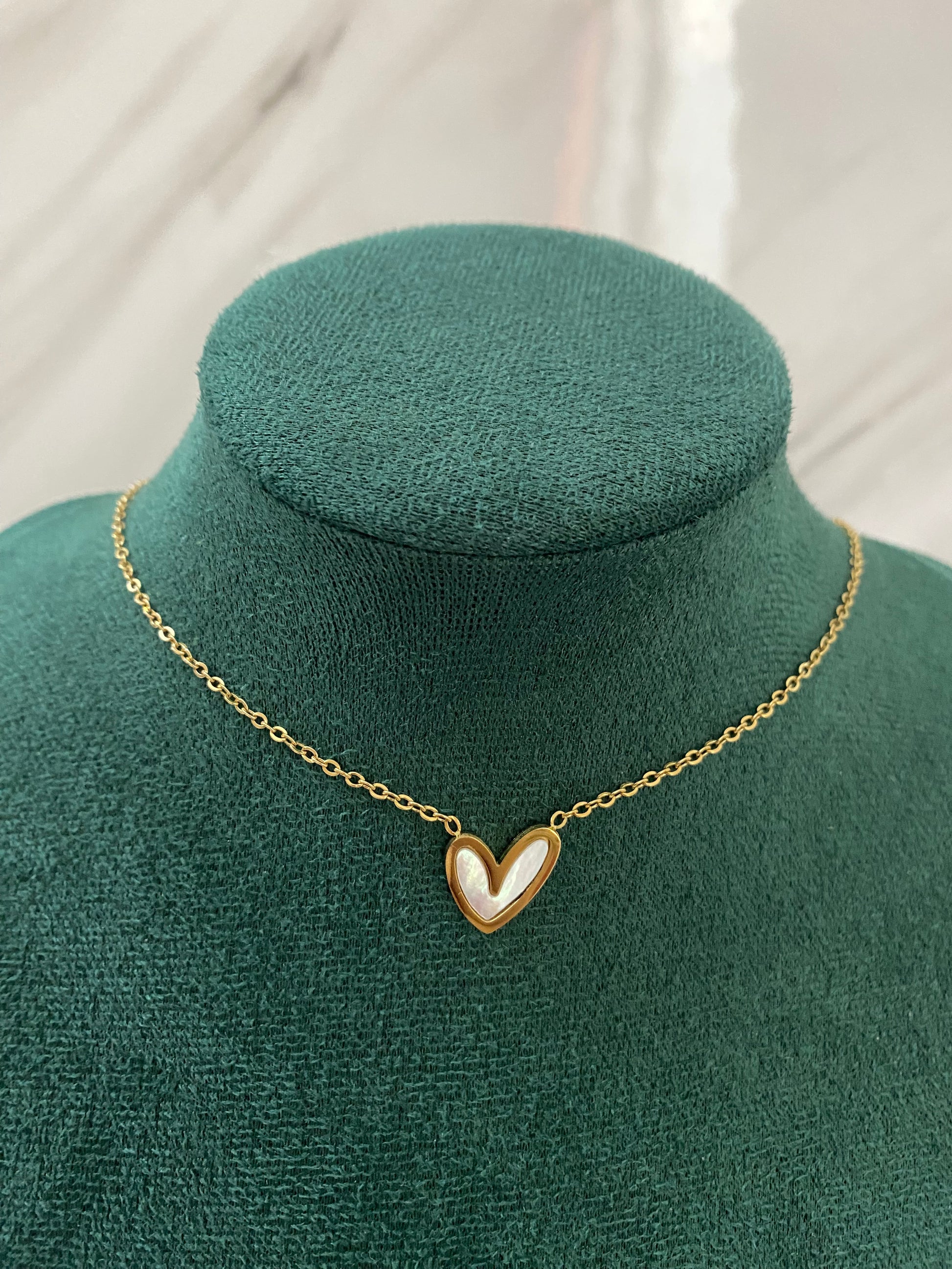 Gold White Stone Heart Necklace featuring a heart-shaped pendant embellished with sparkling white stones. Crafted from premium stainless steel, this waterproof and tarnish-free necklace is ideal for daily wear, romantic gifting, anniversaries, weddings, parties, and special occasions.
